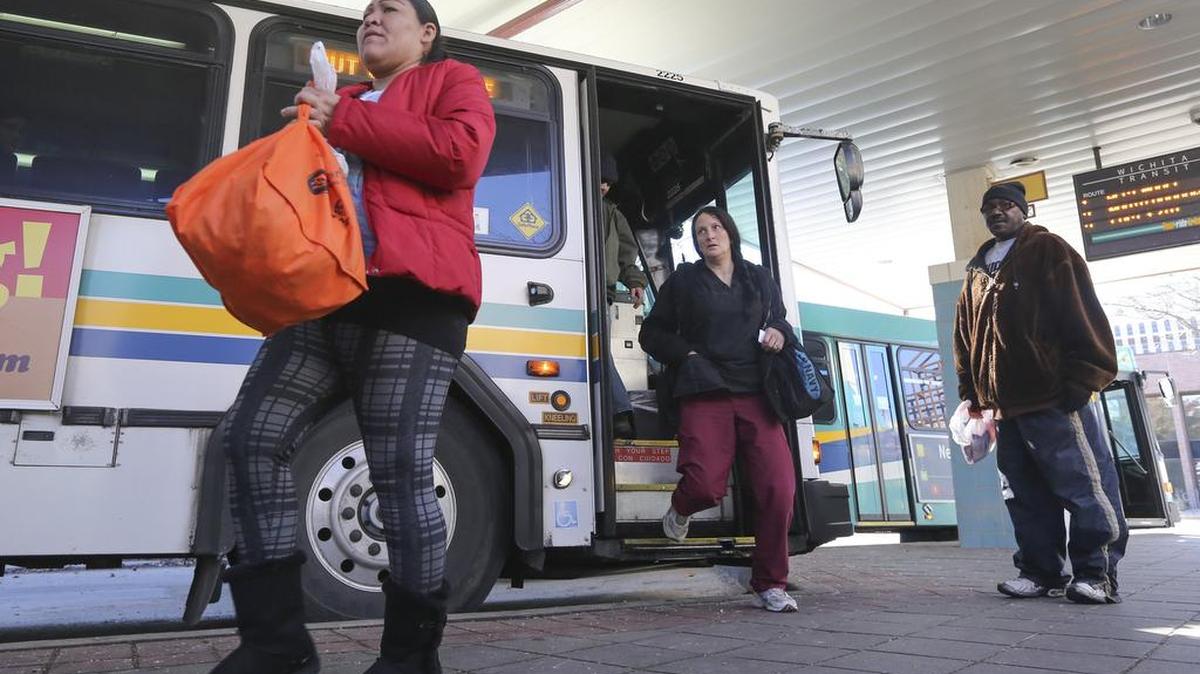 People get off buses at the transit center in downtown Wichita in 2015. Wichita Transit has agreed to a new three-year contract with the Teamsters Union.