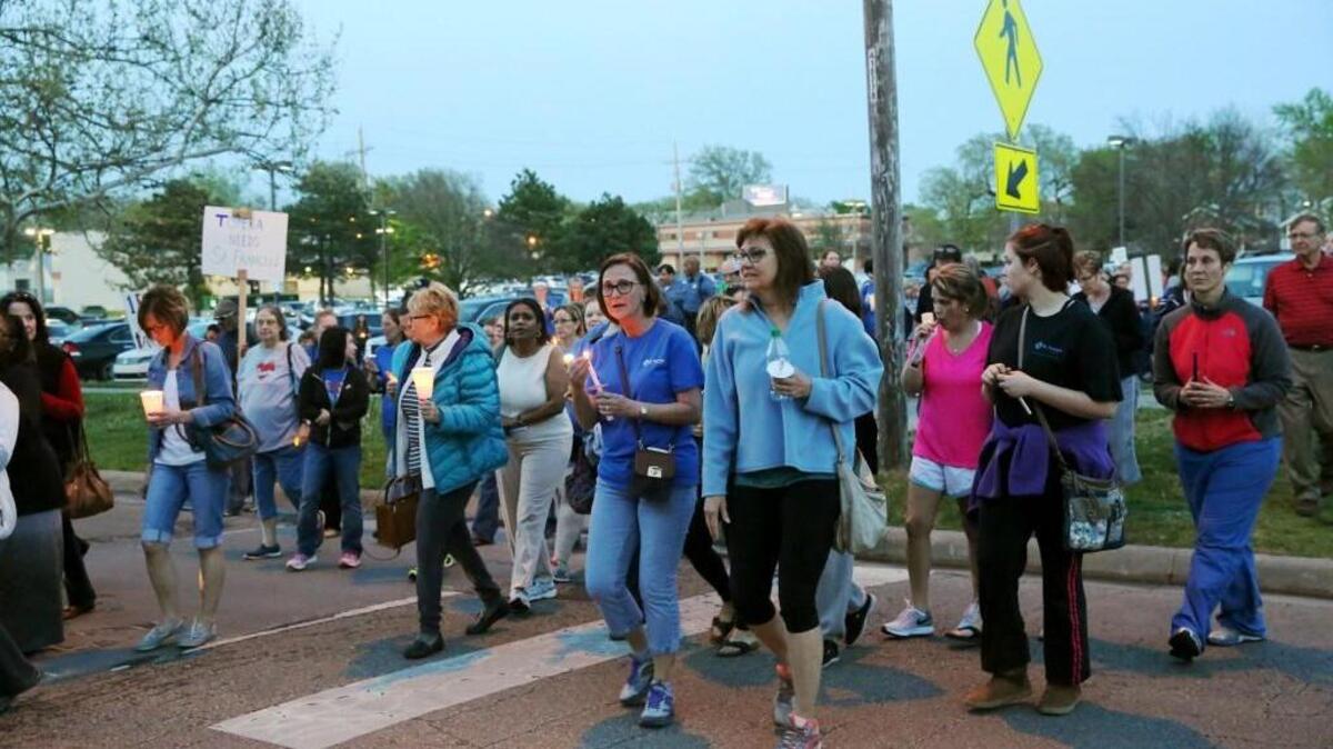 More than 400 people marched during a vigil Monday evening to support St. Francis Health hospital in Topeka. The owner of St. Francis, a nonprofit Catholic hospital, said Tuesday that it will stop operating the facility this summer and that Kansas’ refusal to accept Medicaid expansion contributed to the hospital’s financial troubles. (April 17, 2017)