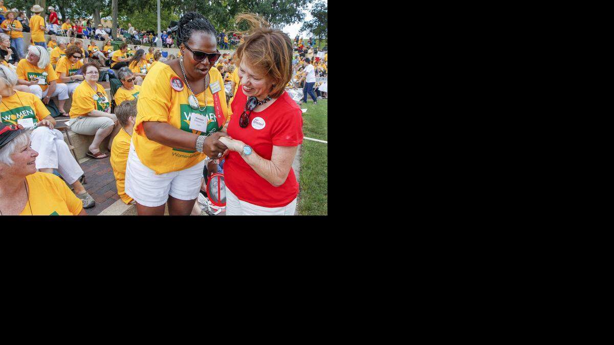 
Jean Schodorf, right, gets support from Monique Pittman-Lui from Topeka during a Women for Kansas “Taking Back Kansas” public rally at A. Price Woodard Park on Friday. Over 500 women turned out to oppose Gov. Sam Brownback. (Aug. 29, 2014)

