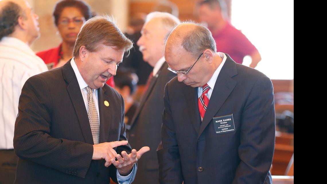 
House Majority Leader Jene Vickrey, left, talks with Rep. Mark Kahrs R-Wichita, after the Kansas House recessed Wednesday morning. 
