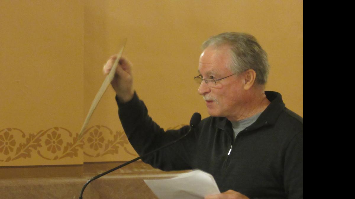 
Merriam City Council member Al Frisby holds up a two-sided sign during a protest at the Capitol on Friday. One side says "That's Not Kansas Values!" and the other says "Now That's Kansas Values!" 
