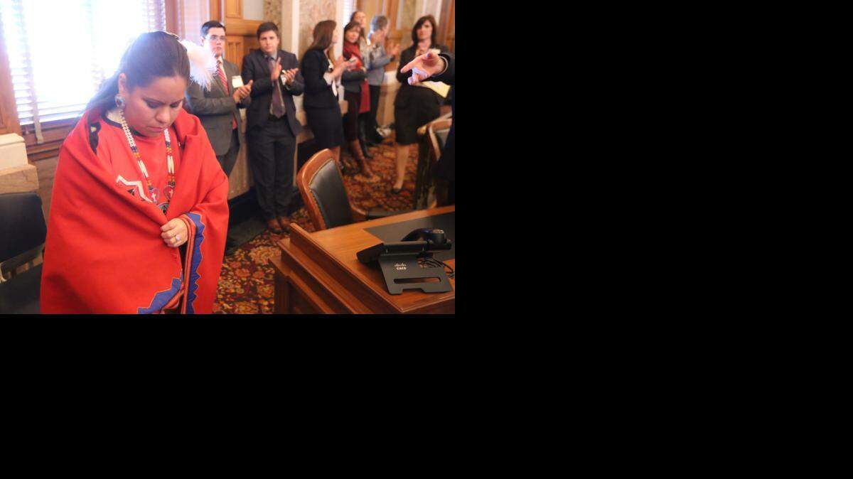 In this 2015 file photo, Rep. Ponka-We Victors wears a blanket that belonged to her great-great-grandmother. On Wednesday, as she became the first Native American woman to preside over the Kansas House, another member made an offensive joke about a tomahawk. Rep. John Wheeler immediately apologized.