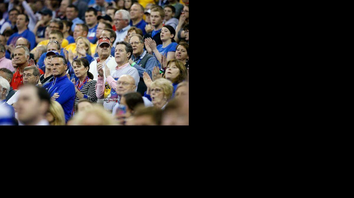 
Kansas Governor Sam Brownback watches the Kansas and Wichita State game in the NCAA Tournament at CenturyLink Center in Omaha. He wore a shirt with pictures of both schools. 
