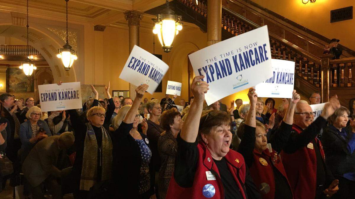 Supporters of Medicaid expansion rally at the Kansas Statehouse on Tuesday.