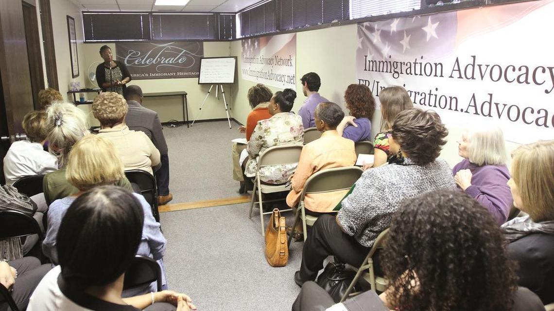 
Sandrine Lisk, managing director of the Immigration Advocacy Network, speaks to a room of concerned people and local leaders who came to protest the Sedgwick County Commission’s plan to cut WIC funding. (Oct. 19, 2015)
