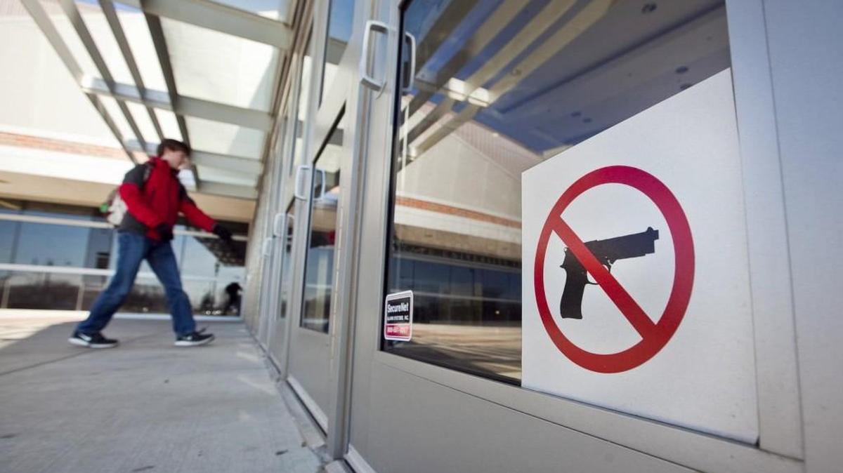 Gov. Sam Brownback has signed a bill that will allow Kansas public employees to carry concealed weapons on the job, starting July 1.