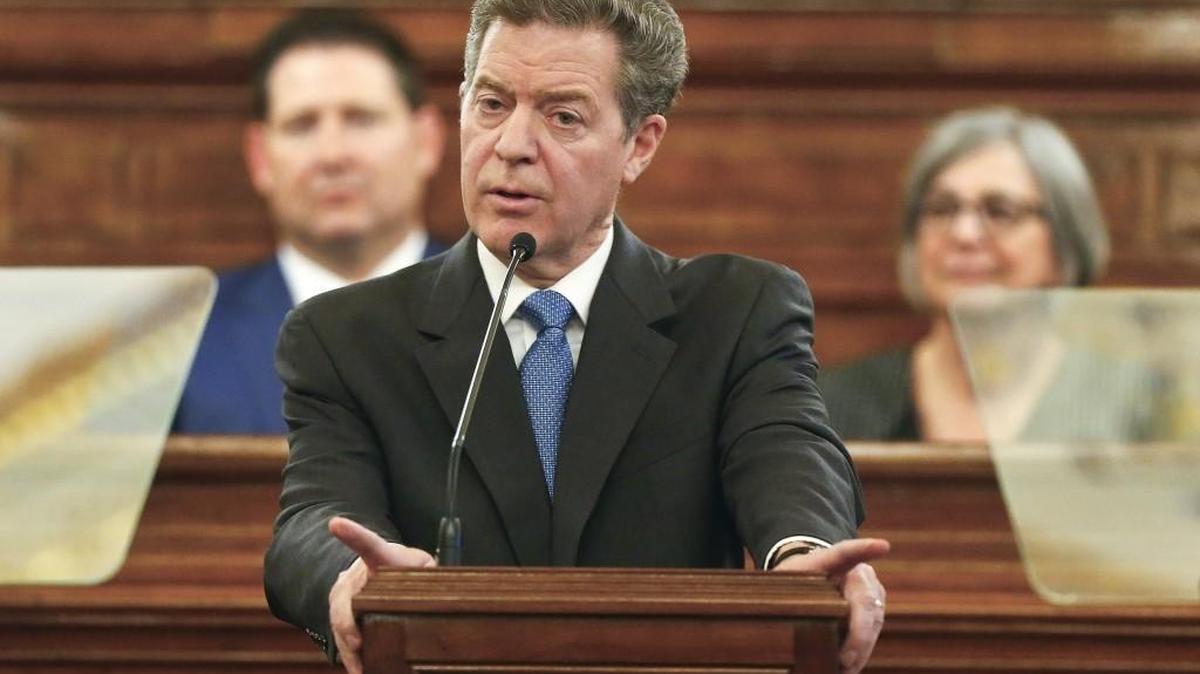 Kansas Gov. Sam Brownback gives his final State of the State address on Tuesday, Jan 1, 2018, on the floor of the Kansas House in Topeka, Kan.