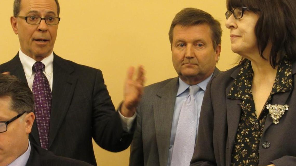 Former Rep. Steve Brunk, left, communicates with other opponents of a bill that would establish anti-discrimination protections for sexual orientation during a January hearing. To his right: House Majority Leader Jene Vickrey and Rep. Jan Pauls.