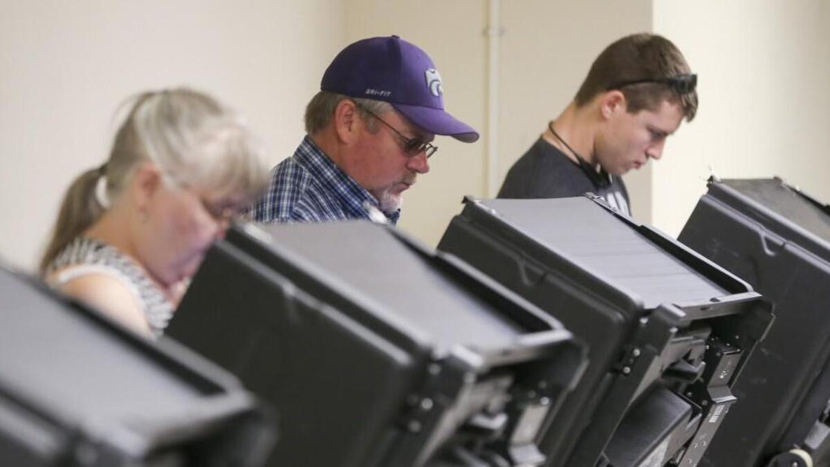 People use electronic voting machines at the Old Sedgwick County Courthouse on Nov. 3 in early voting.