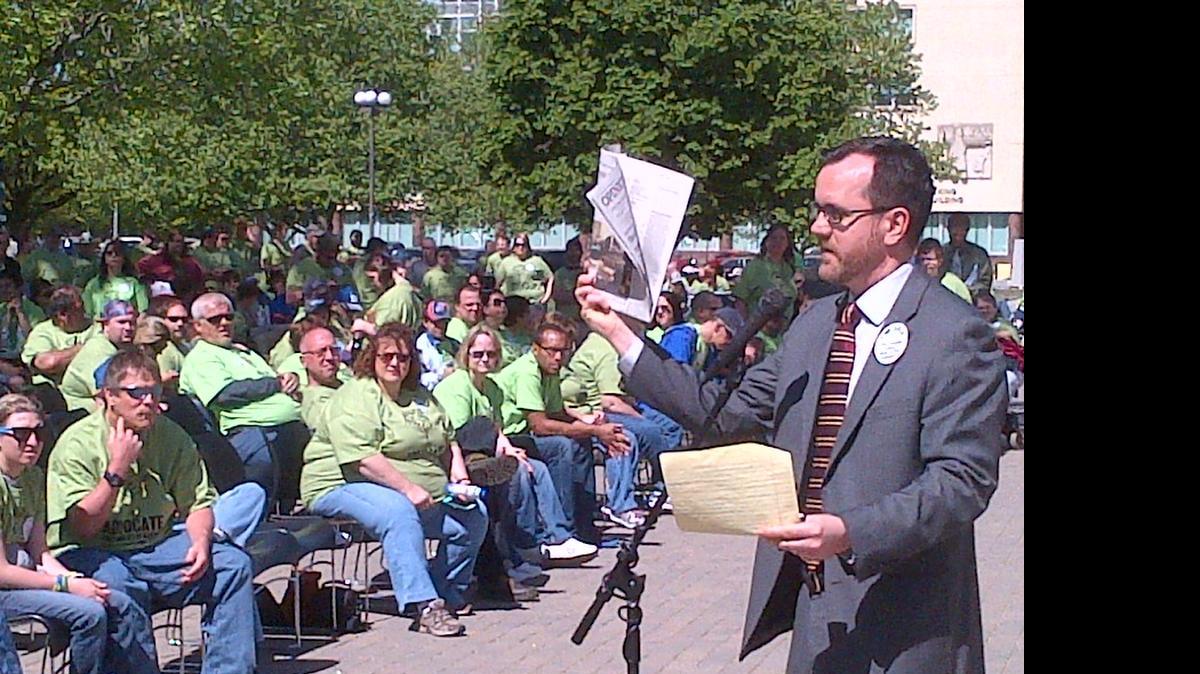 
Rocky Nichols, executive director of the Kansas Disability Rights Center, speaks at a rally of developmentally disabled people and their supporters on the south steps of the Kansas Statehouse on Thursday.
