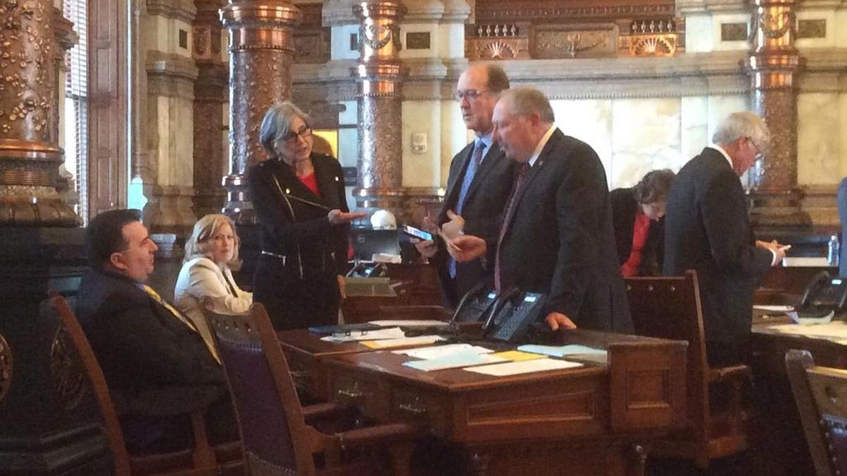 Senate President Susan Wagle, R-Wichita, Senate Vice President Jeff Longbine, R-Emporia, and Senate Majority Leader Jim Denning, R-Overland Park, speak to Sen. Robert Olson, R-Olathe.