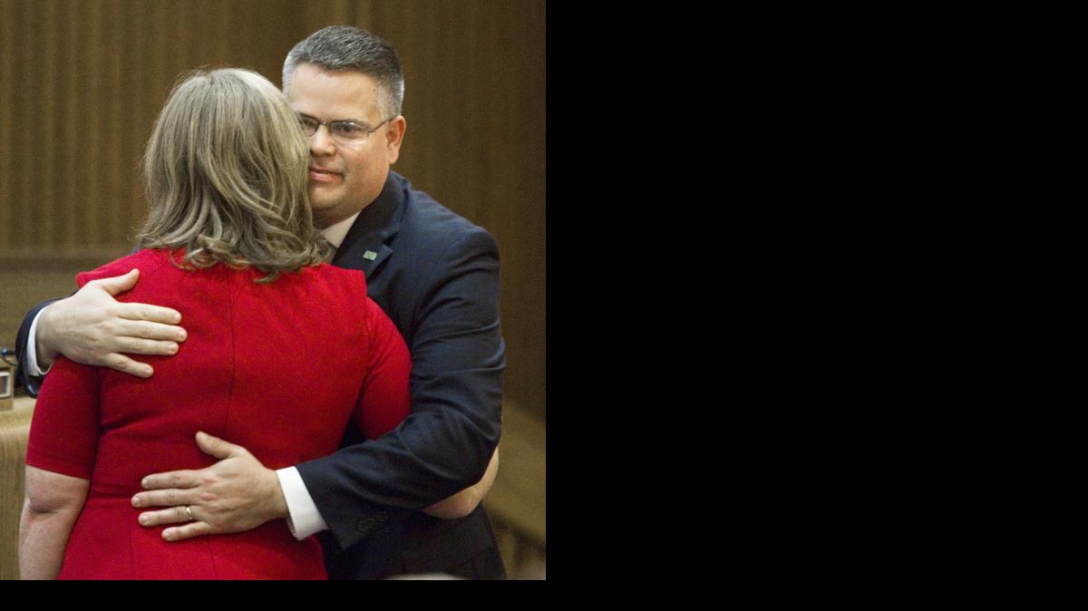 
Caleb Stegall hugs his wife, Ann, after being sworn in as the newest member of the Kansas Supreme Court in Topeka on Friday. (AP Photo/Topeka Capital-Journal, Thad Allton)
