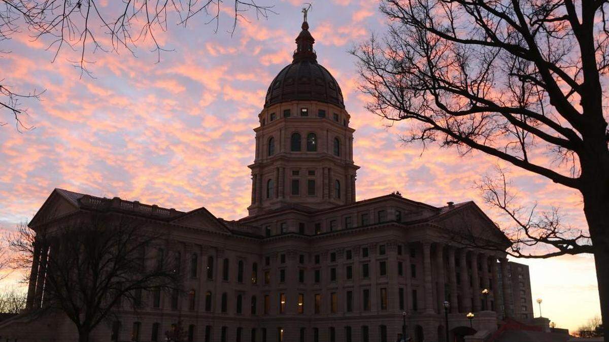 The Kansas Statehouse at sunset.