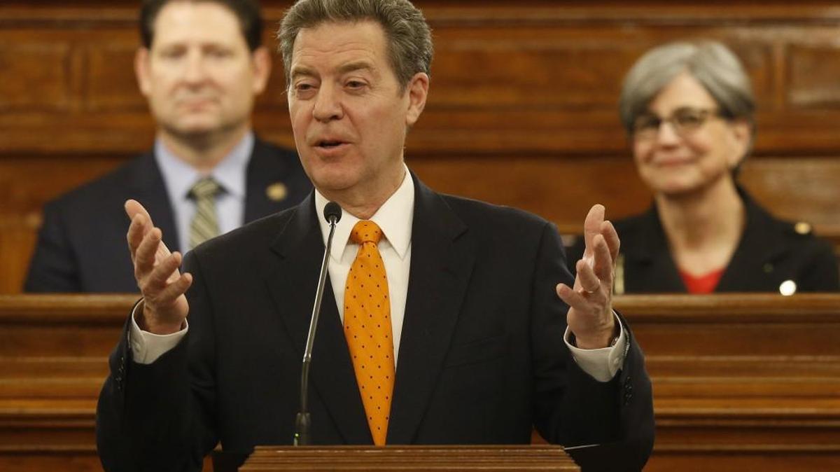 Kansas Gov. Sam Brownback delivers his State of the State address Tuesday night. Behind Brownback is the Speaker of the House, Ron Ryckman, left, and President of the Senate, Susan Wagle. (Jan. 10, 2017)