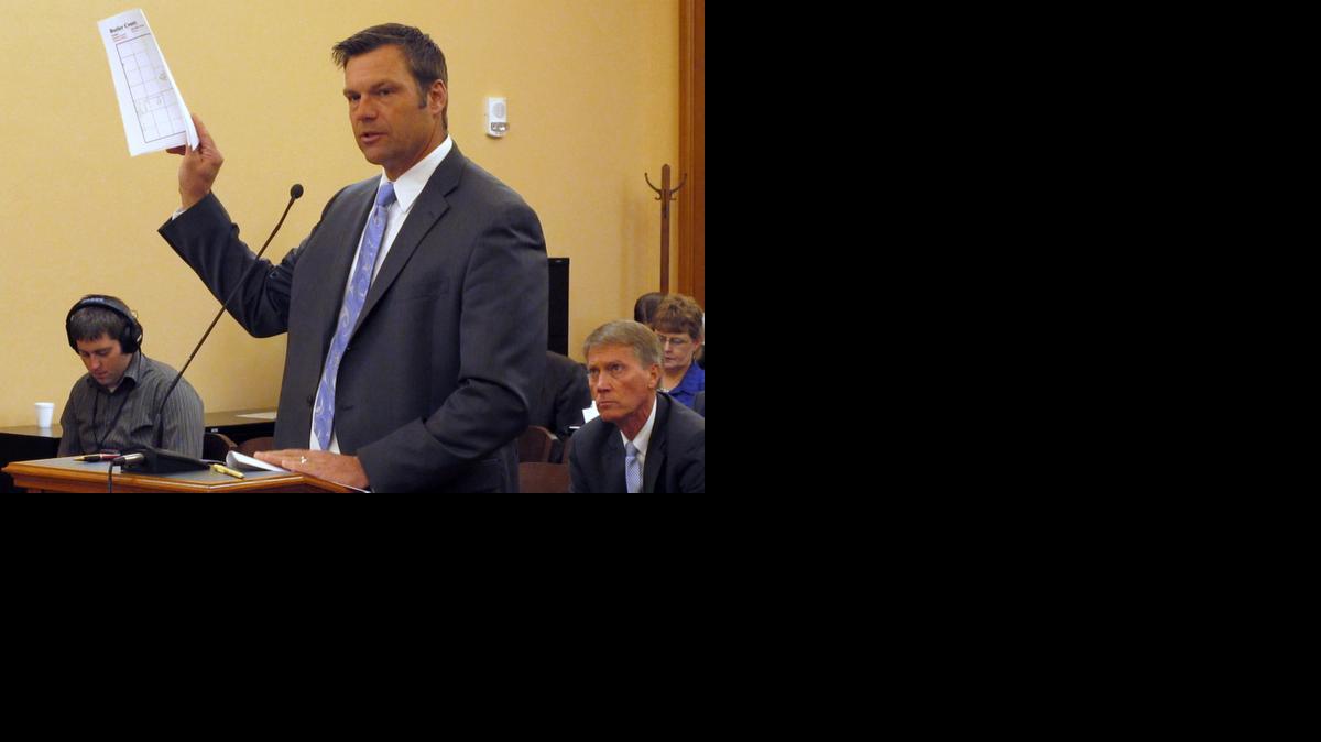 
Kansas Secretary of State Kris Kobach testifies Friday during a meeting of a legislative study committee on election issues at the Statehouse in Topeka. Kobach says he will revive a proposal to allow his office to prosecute election fraud cases. 
