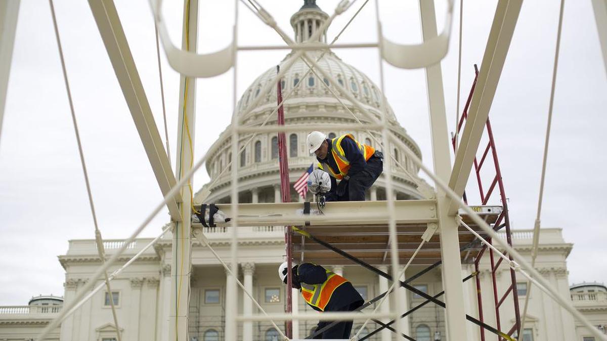 In this Dec. 8, 2016, photo, construction continues on the inaugural platform in preparation for the inauguration and swearing-in ceremonies for President-elect Donald Trump, on the Capitol steps in Washington.