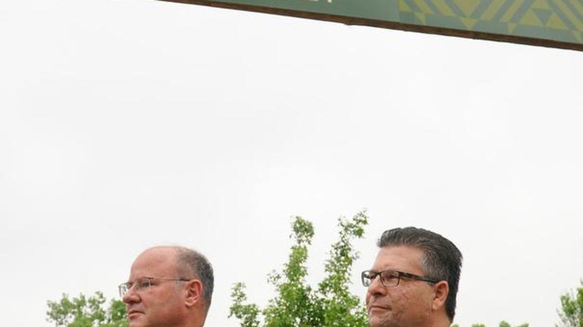 Mark DeVries, left, board president of the Sedgwick County Zoological Society, and Jim Howell, chairman of the Sedgwick County Commission, attend the ribbon-cutting ceremony of the Zambezi River Valley exhibit at the Sedgwick County Zoo in May. (May 27, 2016)