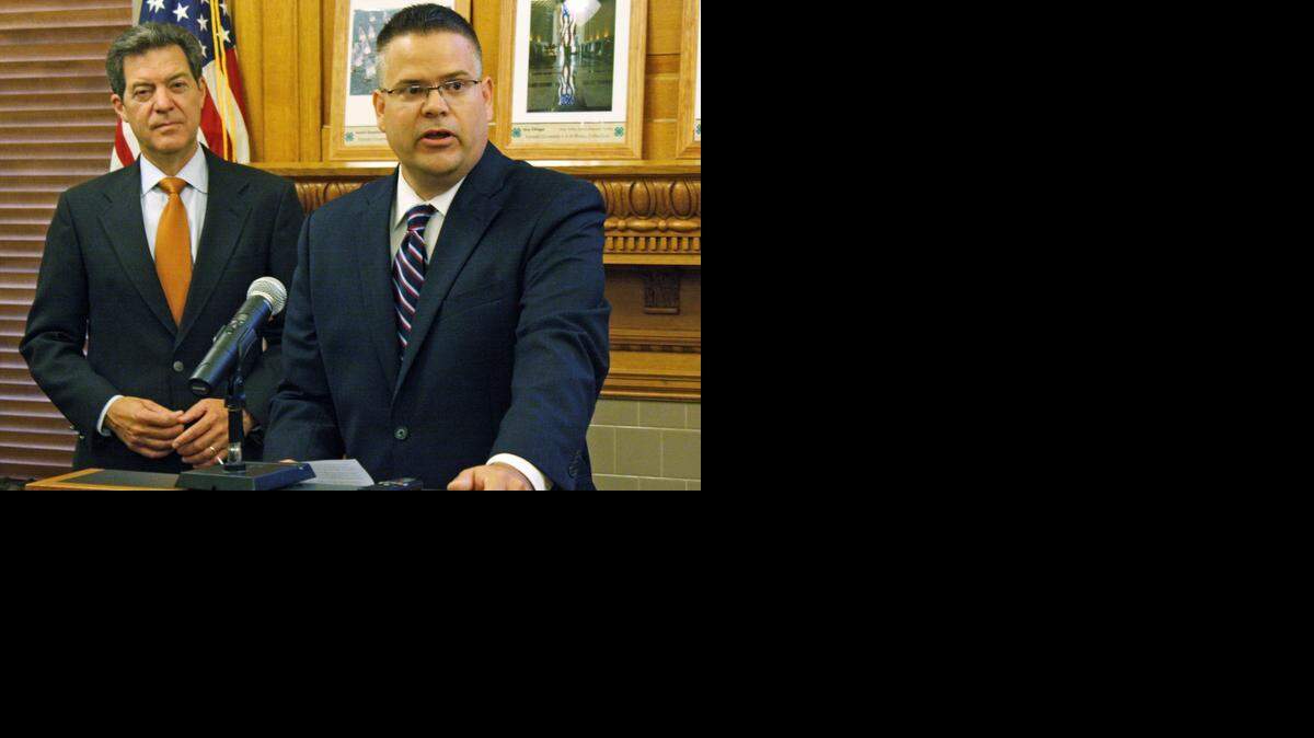 
Caleb Stegall, right, addresses the media after being introduced as the nominee for a Kansas Court of Appeals vacancy by Kansas Republican Gov. Sam Brownback, left, on Aug. 20, 2013, in Topeka. 
