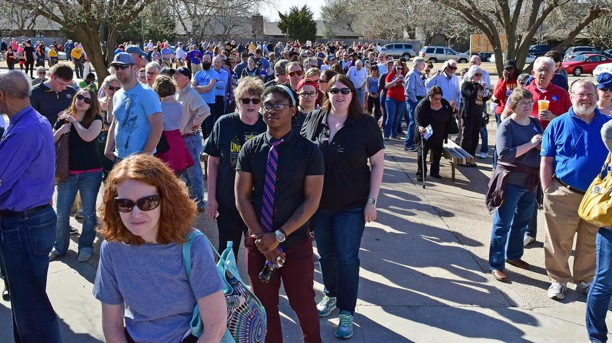 People line up outside Coleman Middle School in March for the Democratic caucus. Kansas’ superdelegates to the Democratic National Convention have signed on with Hillary Clinton despite a near 7-3 victory margin for Vermont Sen. Bernie Sanders in the state caucus.