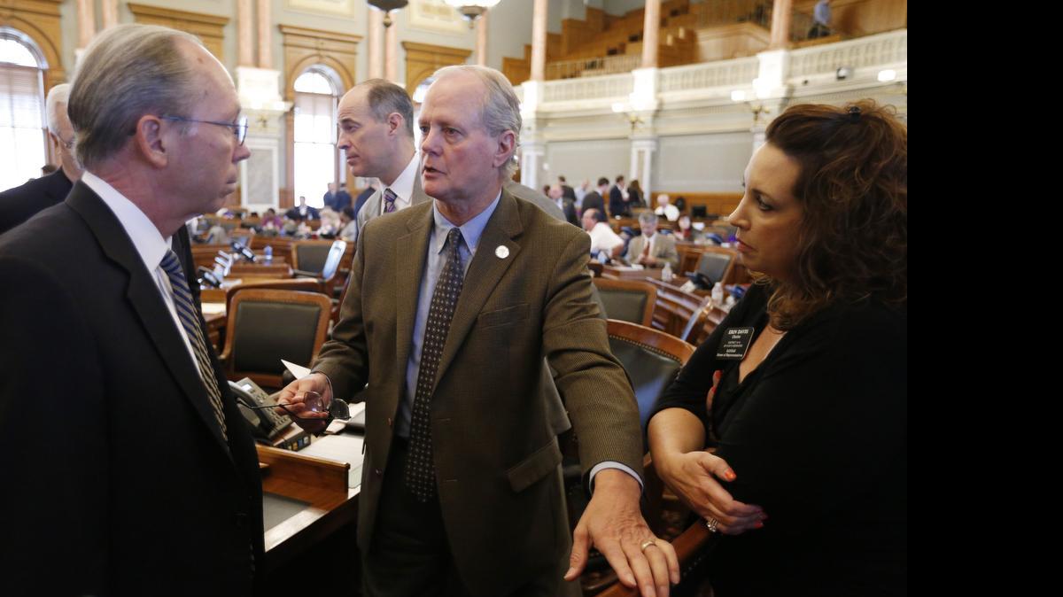 
Rep. Gene Suellentrop of Wichita (center) talks with Kansas House Taxation Committee Chairman Marvin Kleeb, R-Overland Park (left) as Rep. Erin Davis of Olathe looks on after the defeat of HB 2109 Thursday morning.
