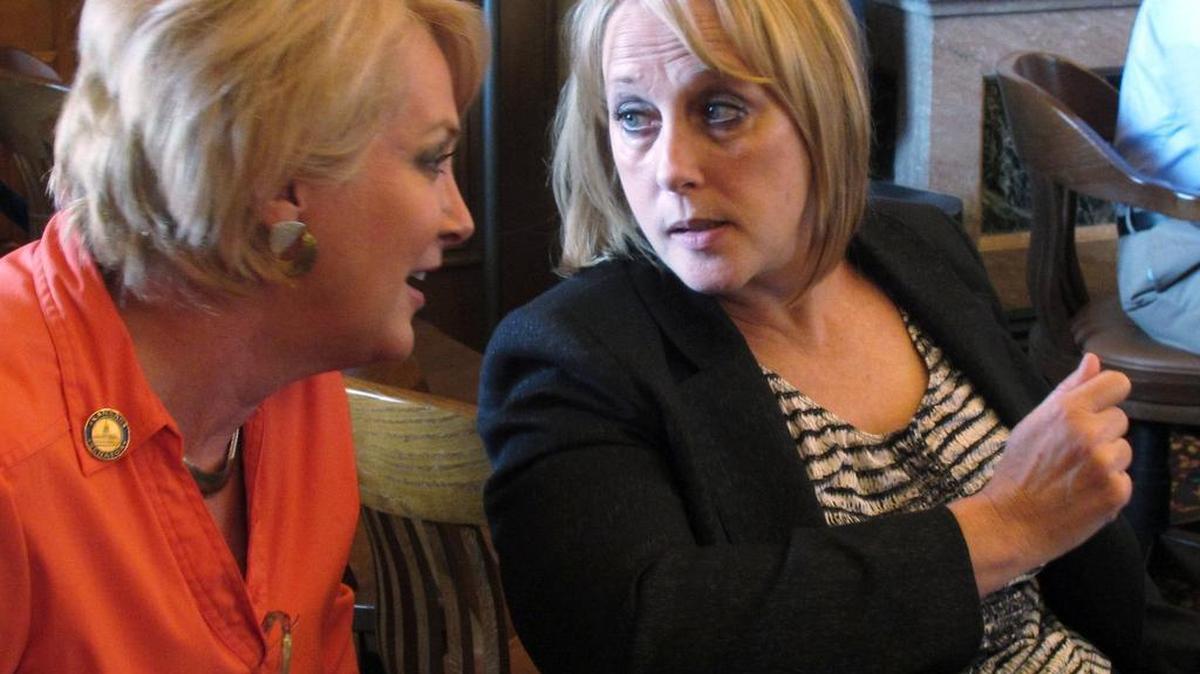 Kansas state Sens. Julia Lynn, left, an Olathe Republican, and Mary Pilcher-Cook, right, a Shawnee Republican, converse in the House chamber as state representatives debate an anti-abortion bill in 2012 in Topeka, Kan. Both senators strongly oppose abortion. This week, during the Kansas Legislature’s 2016 session, Pilcher-Cook opposed an amendment that would have instructed the Kansas Department of Health and Environment to contract with family planning providers to offer long-acting reversible contraceptives, similar to a Colorado initiative that reduced teen pregnancy rates.