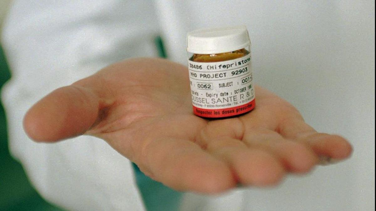 Controversial pill. Dr. David Grimes of the University of California at San Francisco holds a container of the abortion pill RU-486.