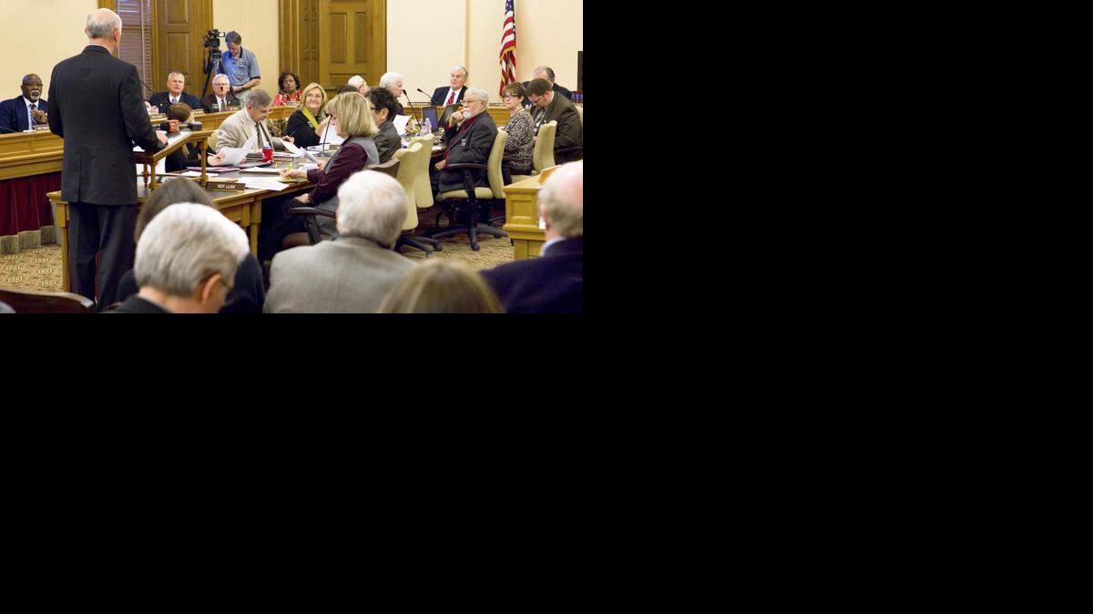 
The K-12 Student Performance and Efficiency Commission chairman, Sam Williams, left, a Wichita businessman and mayoral candidate, presents the commission’s report to the joint House and Senate Education committee Wednesday, Jan. 14, 2015, at the Statehouse in Topeka.
