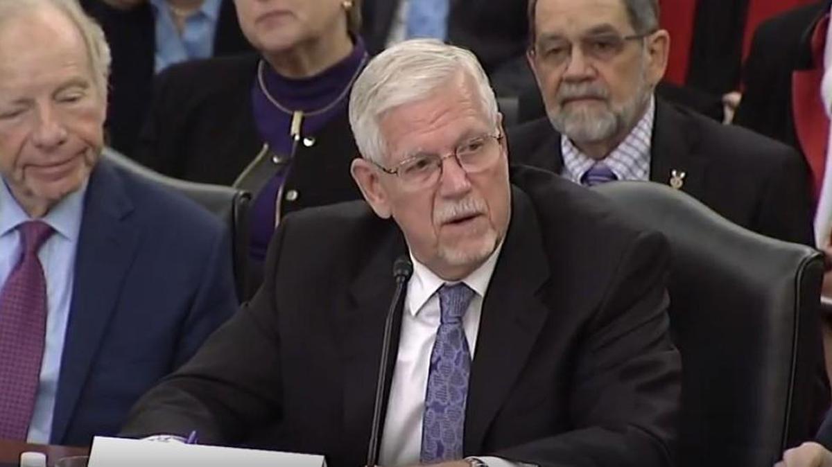 Seated next to former U.S. Sen. Joseph Lieberman, Kansas State University President Richard Myers testifies on the danger to the U.S. food supply from terrorism and emerging diseases.