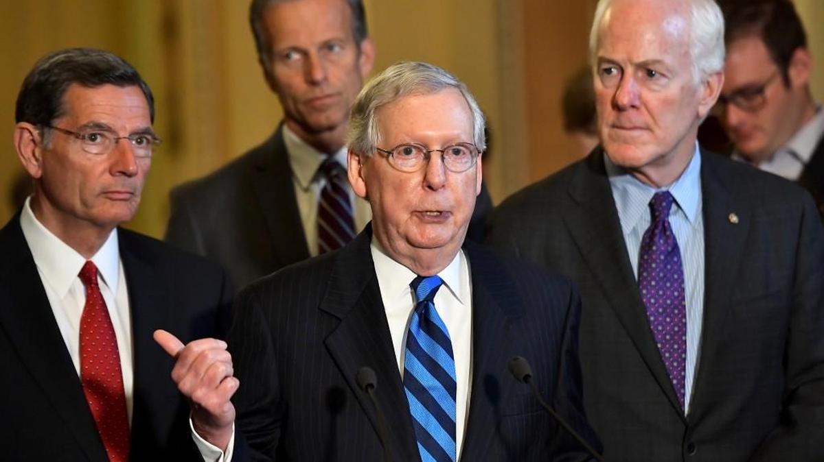 Senate Majority Leader Mitch McConnell, center, R-Ky., speaks Thursday at the Capitol.