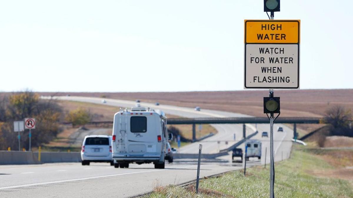 Recently installed signs and lights warn drivers of high water in two spots along the Turnpike south of Emporia. (Nov. 6, 2015)