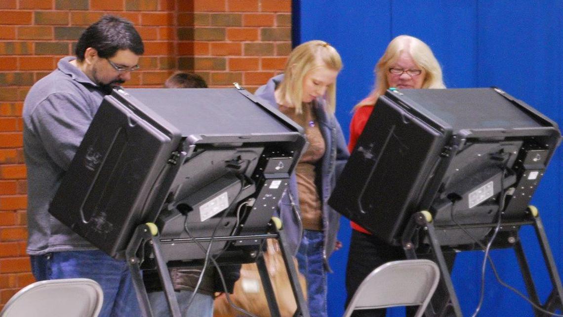 
People vote on machines at the Linwood Recreation Center. A mathematician at Wichita State University who wanted to check the accuracy of some Kansas voting machines after finding odd patterns in election returns said she is finding out how difficult it can be to get government officials to turn over public documents. 

