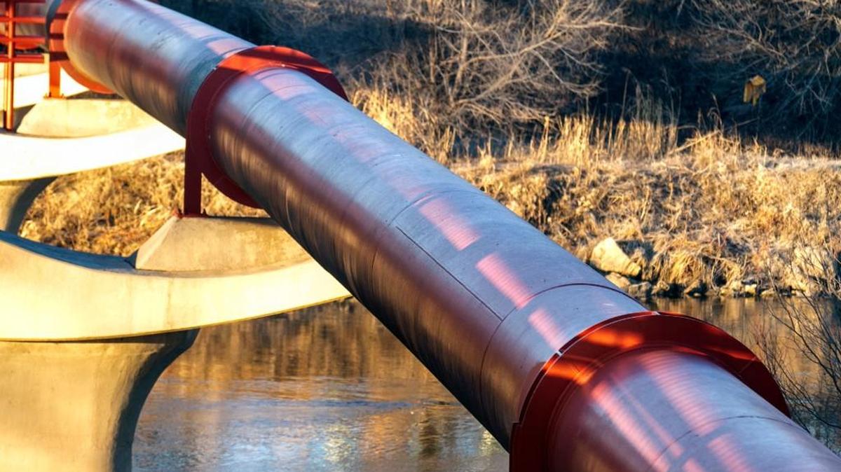 A water pipe from Cheney Reservoir spans the Arkansas river in Sim Park in 2015. A recent water main break in Mulvane caused the city to issue a boil water advisory until Tuesday.