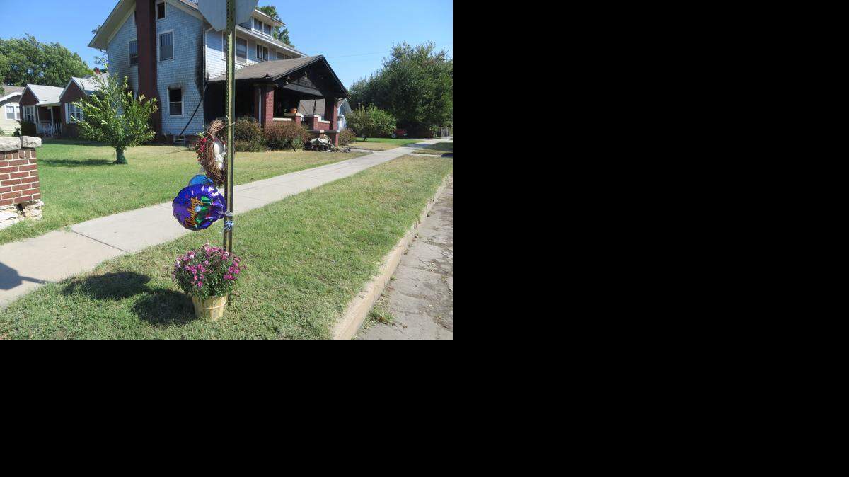 
A memorial was placed near the Hutchinson house where a mother and daughter were killed in an arson fire in September 2013. (Sept. 27, 2013)
