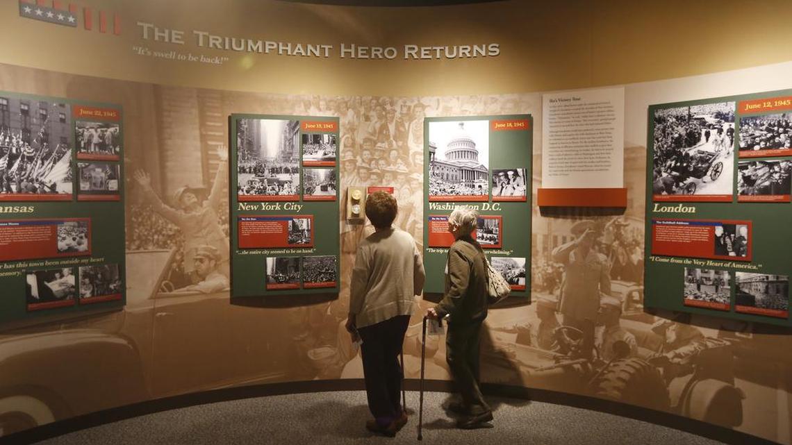 
Visitors to the Eisenhower Museum study a display. (Aug. 20, 2015) 
