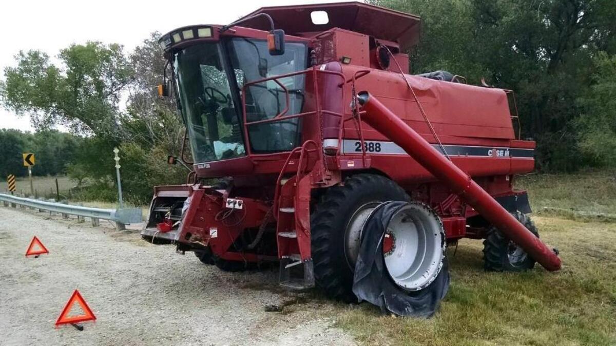 
This photo provided by Andrew Sieker shows a stolen combine on the side of a road near Ellinwood where it stopped after police in pursuit fired at the fleeing piece of farm equipment to disable it Wednesday, Sept. 23, 2015. 
