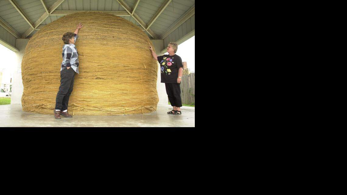 
In 2003, Lottie Herod of Cawker City, left, tried to reach the top of the “World’s Largest Ball of Twine” with Linda Clover, the “keeper of the twine.” Cawker City was celebrating the 50th anniversary of the quirky Kansas attraction.
