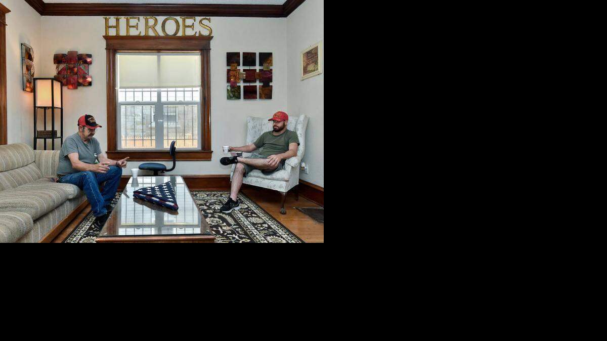 
Vietnam veteran George Turner (left) and Afghanistan veteran Grant Garrison discussed their experiences leading them to Heroes Home Gate, a shelter for homeless veterans in Kansas City that was dedicated Saturday. Turner and Garrison will both live at the new home, which features a larger kitchen than the old house and has a cozy living room.
