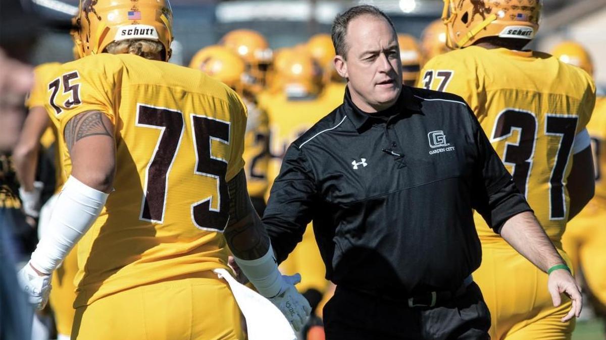 Garden City Community College football Coach Jeff Sims congratulates players on scoring a touchdown as they head to the sidelines during a November game in Garden City. Football player Sean Callahan, 19, was found dead Sunday in Kismet.