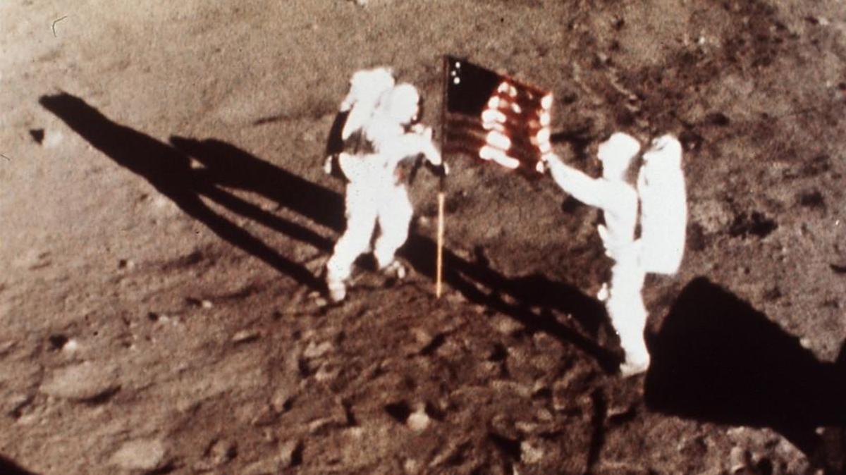 Apollo 11 astronauts Neil Armstrong and Edwin “Buzz” Aldrin, the first men to walk on the moon, planted the U.S. flag on the lunar surface on July 20, 1969. Armstrong and Aldrin spent nearly three hours collecting samples, conducting experiments and taking photographs.