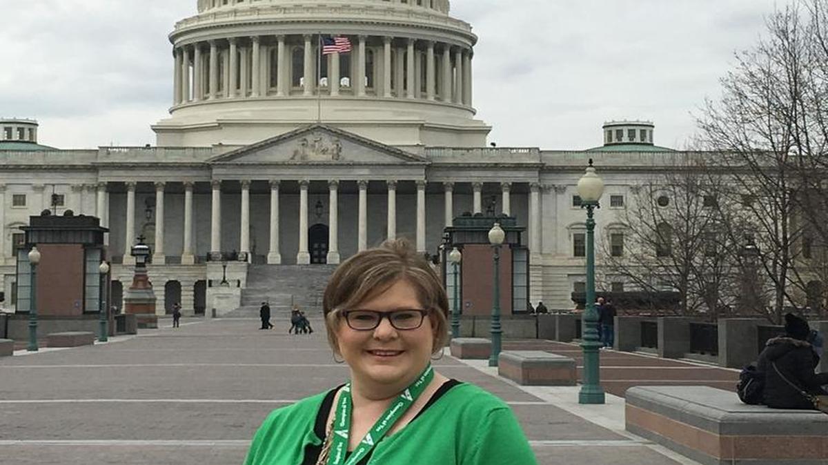Staci Penner stands in front of the U.S. Capitol building, where she asked members of Congress for more affordable health care.