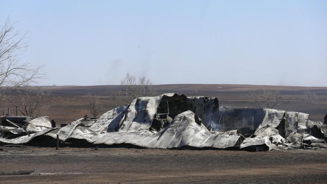 All that is left of a barn east of Ashland on Tuesday morning is a melted roof. Strong winds drove a wildfire through the area, destroying homes and thousands of acres of farmland. (March 7, 2017)