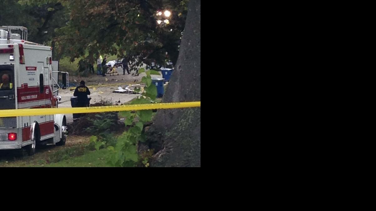 
Emergeny personnel work the scene of a small plane crash in the Chicago suburb of Palos Hills, Ill. Three people aboard the twin-engine Beechcraft Baron died in the Sunday night crash shortly after takeoff from Chicago Midway Airport en route to Lawrence.
