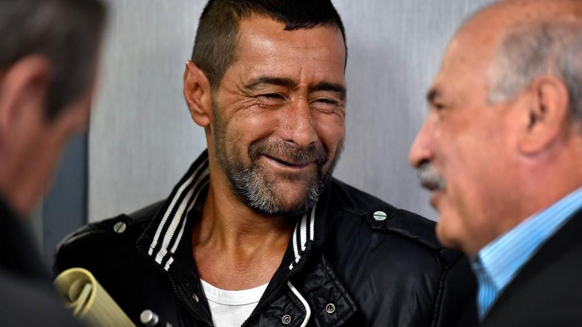 Ahmad al-Abboud, center, who with his wife and children became the first Syrian family to be resettled to the United States under the new “surge operation,’’ spoke to the media Monday morning with the help of interpreter Fariz Turkmani, right.