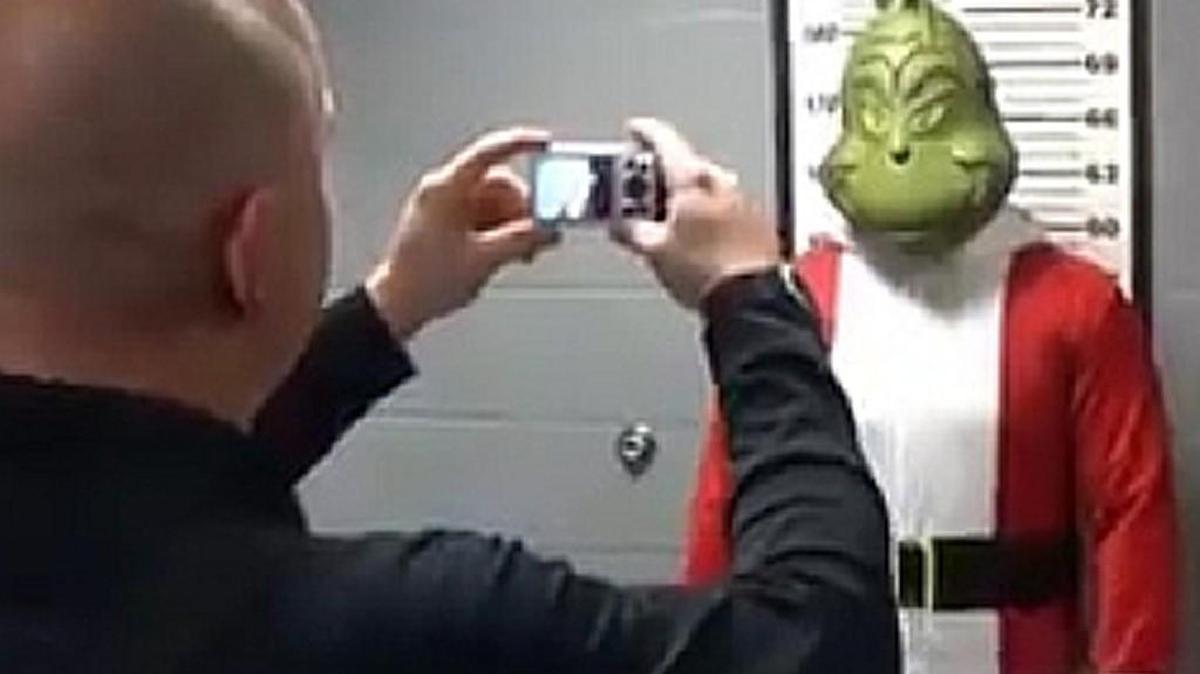 Paola police take a mug shot of the Grinch after he was caught burglarizing the city’s homes in the department’s holiday video.