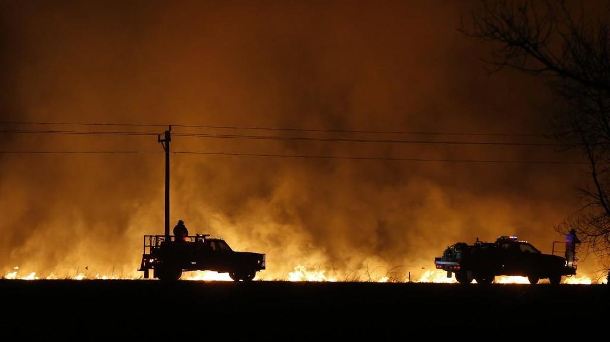 Fire fighters from across Kansas and Oklahoma battle a major wildfire near Protection last March. Officials say the risk for wildfires is elevated across most of Kansas and the southern Plains thanks to drought conditions and plenty of dead vegetation primed to burn.