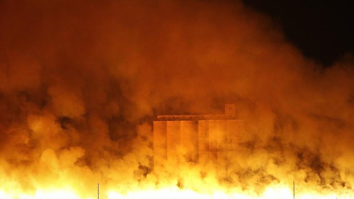 Flames and smoke envelope the grain elevator in Sitka, Kansas, in the early morning hours Tuesday. Wildfires swept by high winds threatened numerous towns across southern Kansas Monday night and Tuesday morning.