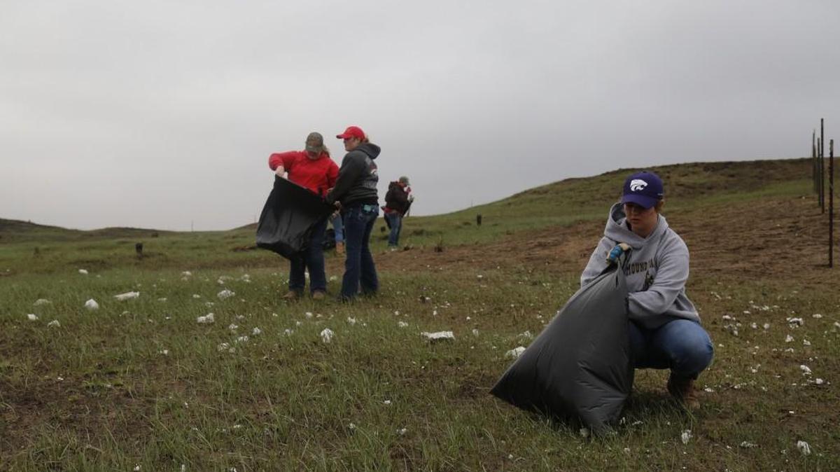 Volunteers help clean up property in Clark County that was damaged by wildfires earlier this month.
