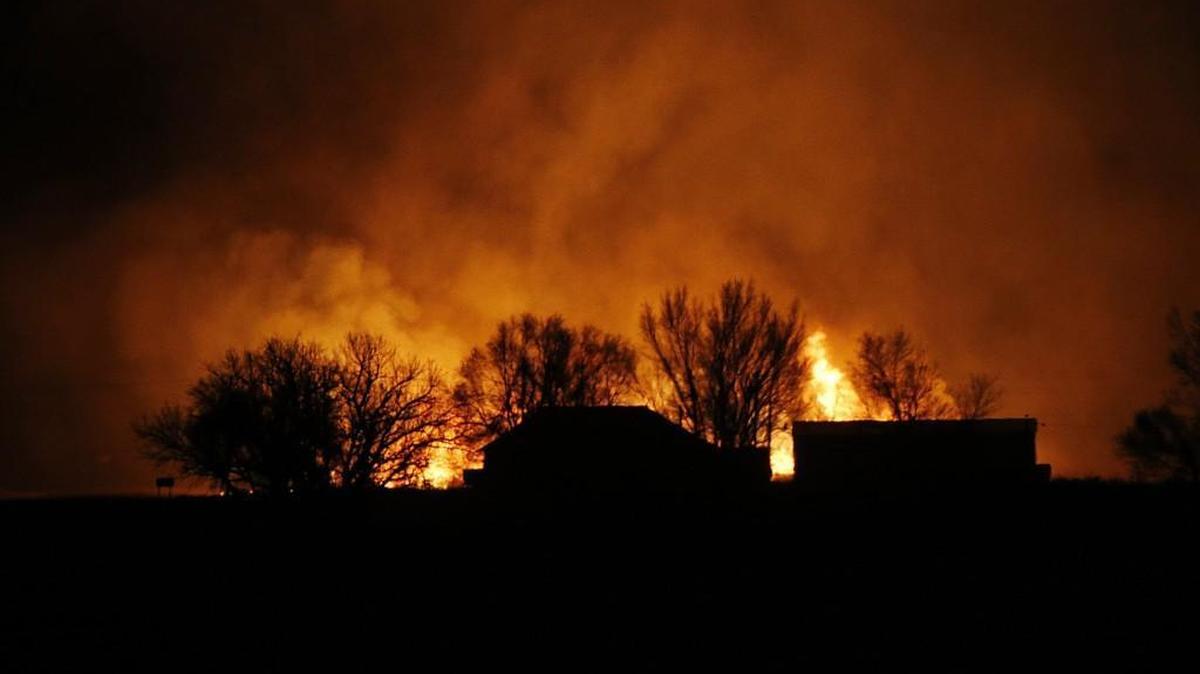 Fire sweeps through the tiny Kansas town of Sitka early Tuesday morning. Wildfires swept by high winds threatened numerous towns across southern Kansas Monday night and Tuesday morning.