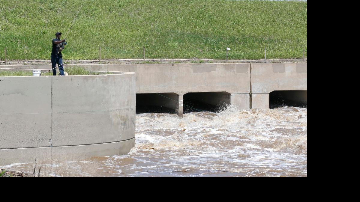 
A fisherman casts from the spillway Tuesday near I-235 and the 25th Street exit. (May 26, 2015)

