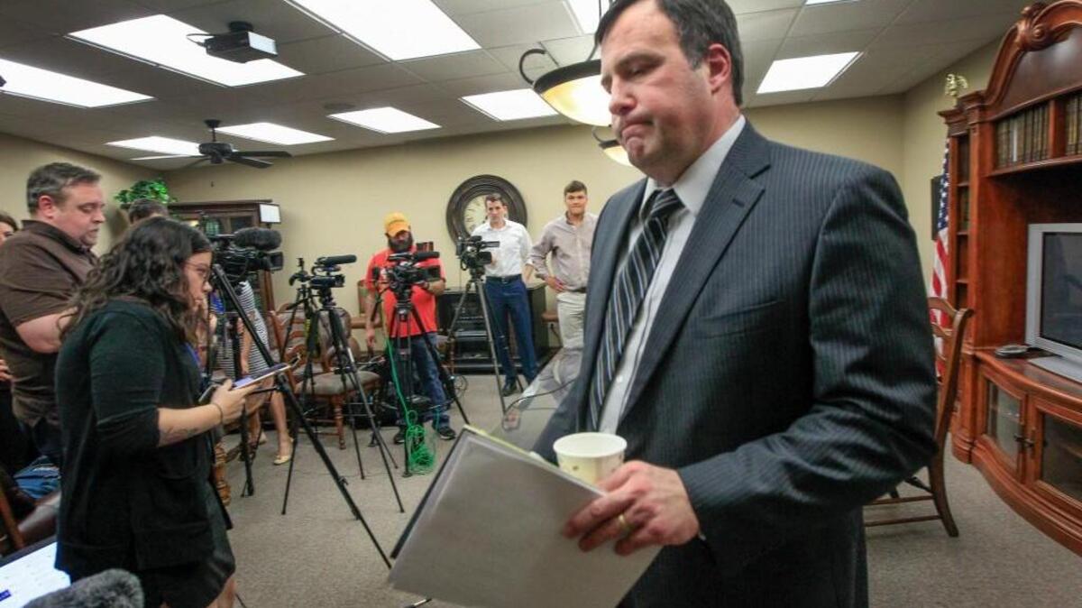 Sedgwick County District Attorney Marc Bennett leaves a news conference Thursday after announcing that the Wichita police officer involved in the fatal shooting of Andrew Finch during a swatting incident in late December will not be charged.